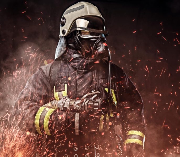 professional-firefighter-dressed-uniform-oxygen-mask-standing-fire-sparks-smoke-dark-background (1)